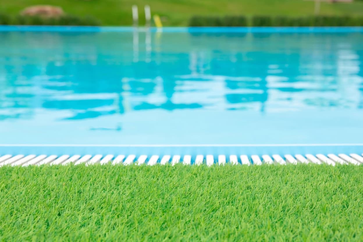 Artificial turf around pool installation in Boca Raton